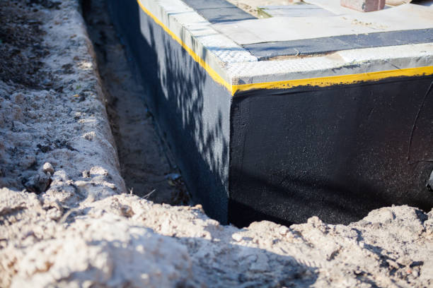 Professional Waterproofing technician working in Churchville, NY